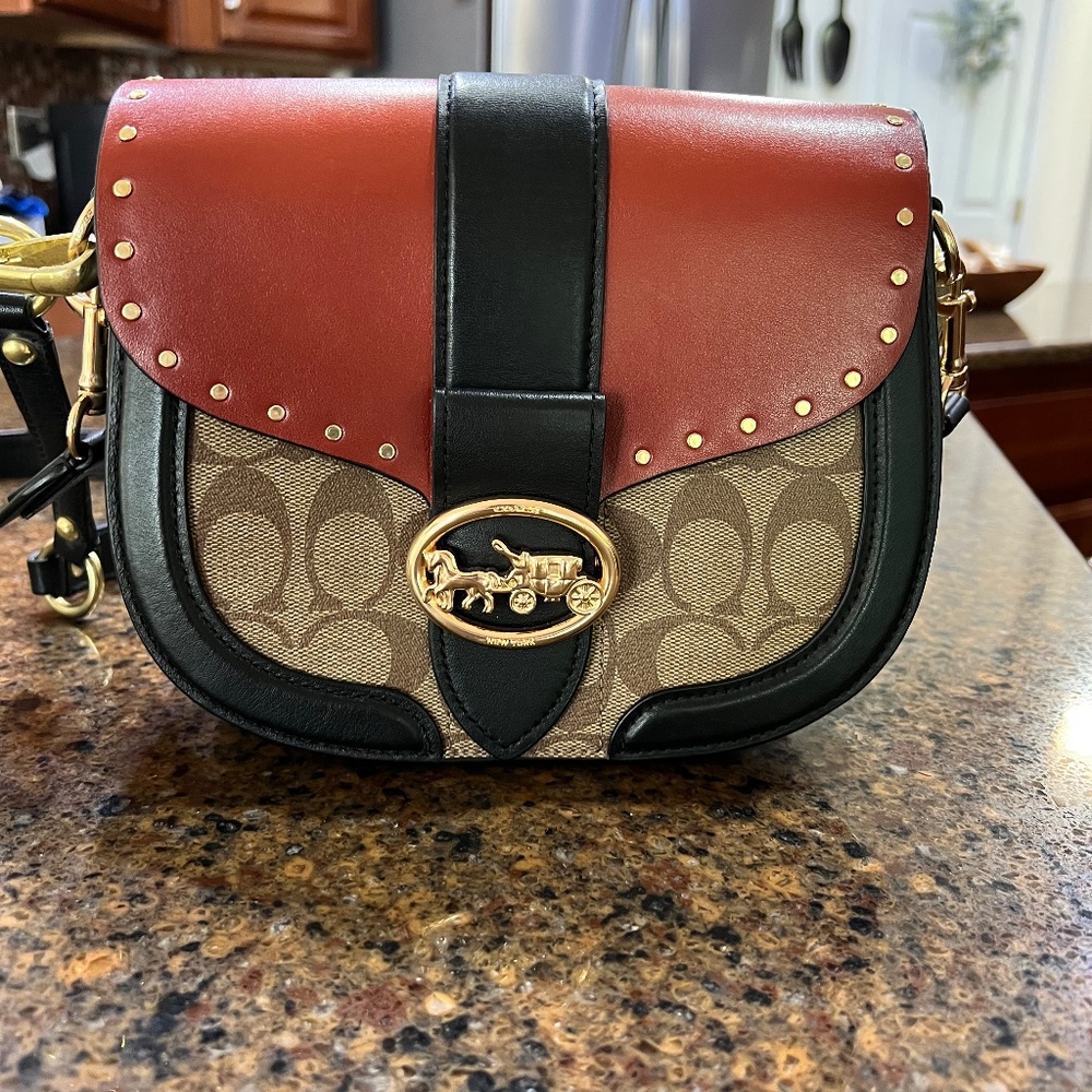 Saddle coach purse